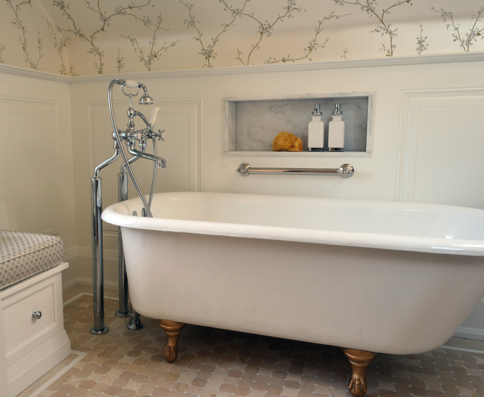 Inspiration for a mid-sized traditional master bathroom in Toronto with recessed-panel cabinets, white cabinets, a claw-foot tub, a one-piece toilet, beige tile, terra-cotta tile, mosaic tile floors, an undermount sink and marble benchtops.