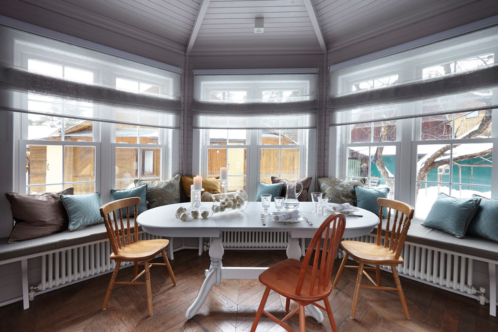 This is an example of a scandinavian dining room in Moscow with medium hardwood floors.