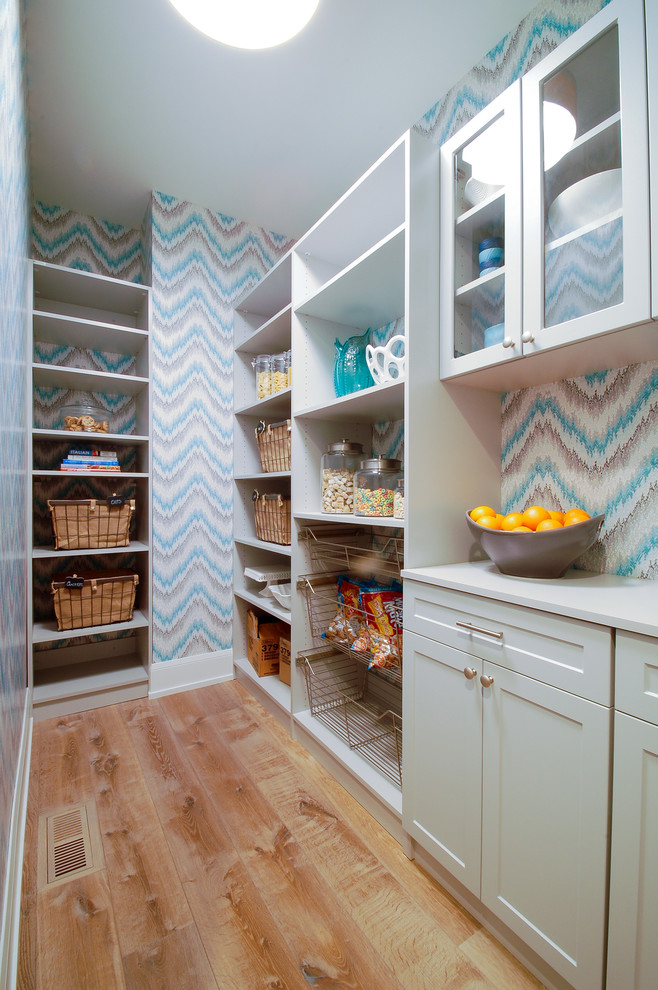 Mid-sized beach style l-shaped kitchen pantry in Minneapolis with shaker cabinets, grey cabinets, laminate benchtops, light hardwood floors and no island.