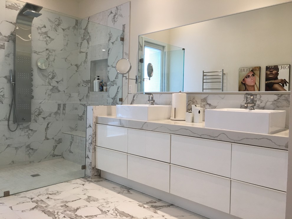 Design ideas for a mid-sized contemporary master bathroom in Orange County with flat-panel cabinets, turquoise cabinets, an alcove shower, gray tile, stone tile, white walls, marble floors, a vessel sink, marble benchtops, white floor and a sliding shower screen.