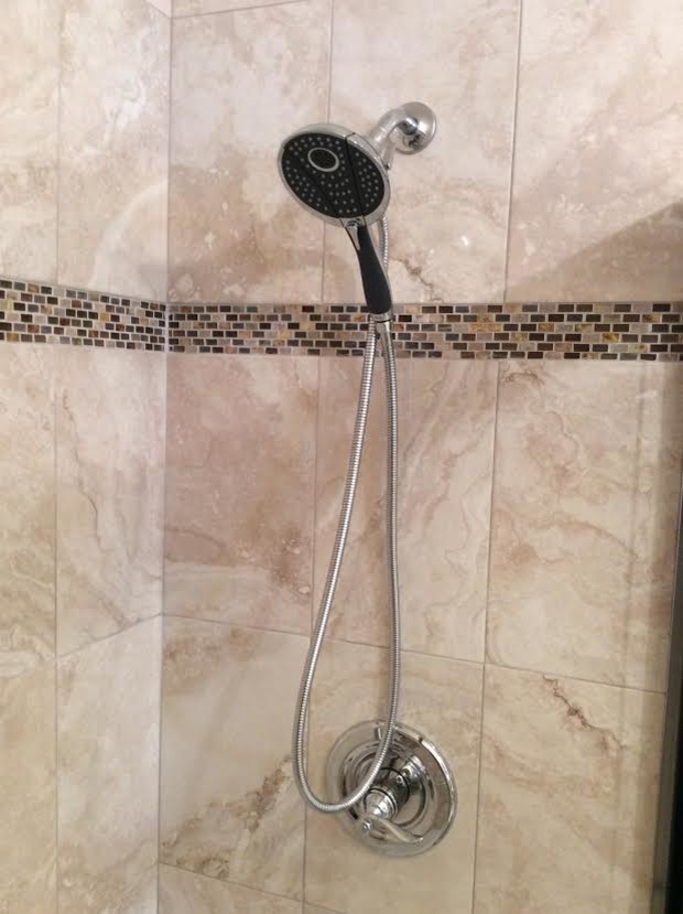 Inspiration for a small transitional beige tile and ceramic tile porcelain tile alcove shower remodel in Charleston