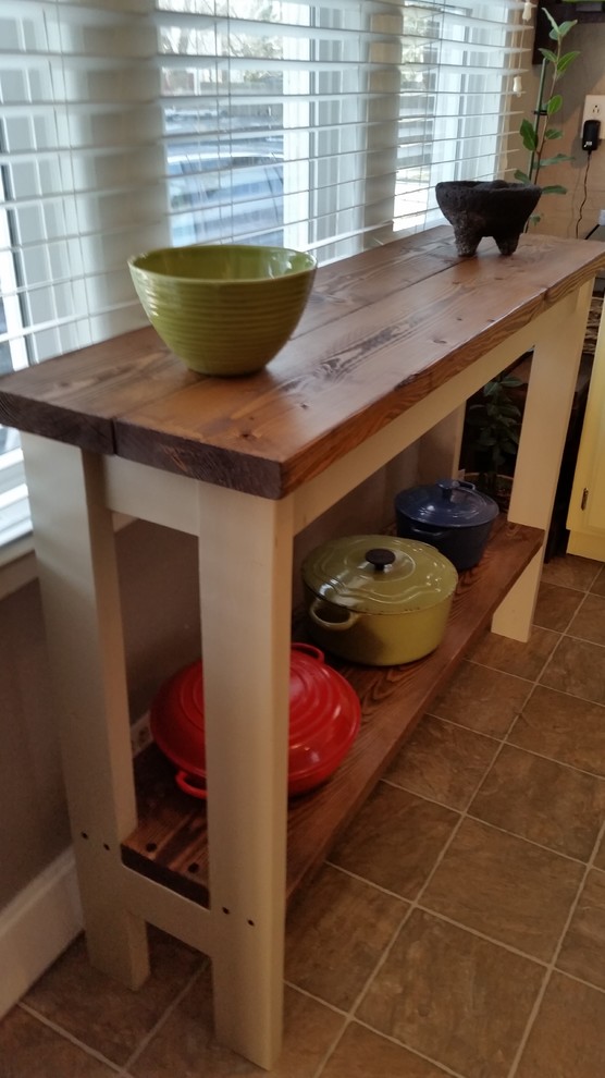 Inspiration for a small country kitchen in Seattle with wood benchtops and with island.