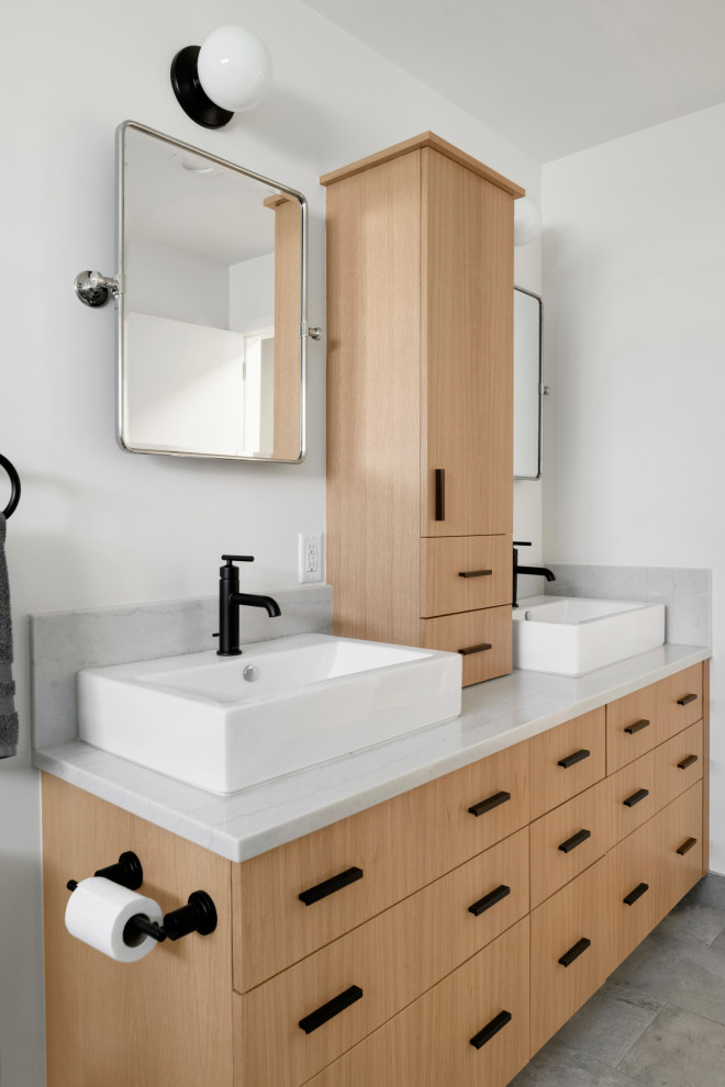 Bathroom - mid-sized mid-century modern kids' white tile and ceramic tile ceramic tile, gray floor and double-sink bathroom idea in Minneapolis with flat-panel cabinets, light wood cabinets, white walls, a vessel sink, quartz countertops, white countertops and a freestanding vanity