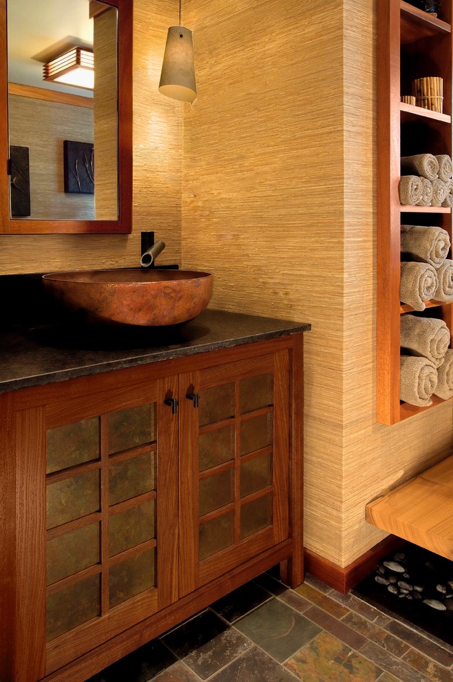 This is an example of a large asian master bathroom in San Diego with dark wood cabinets and beige walls.