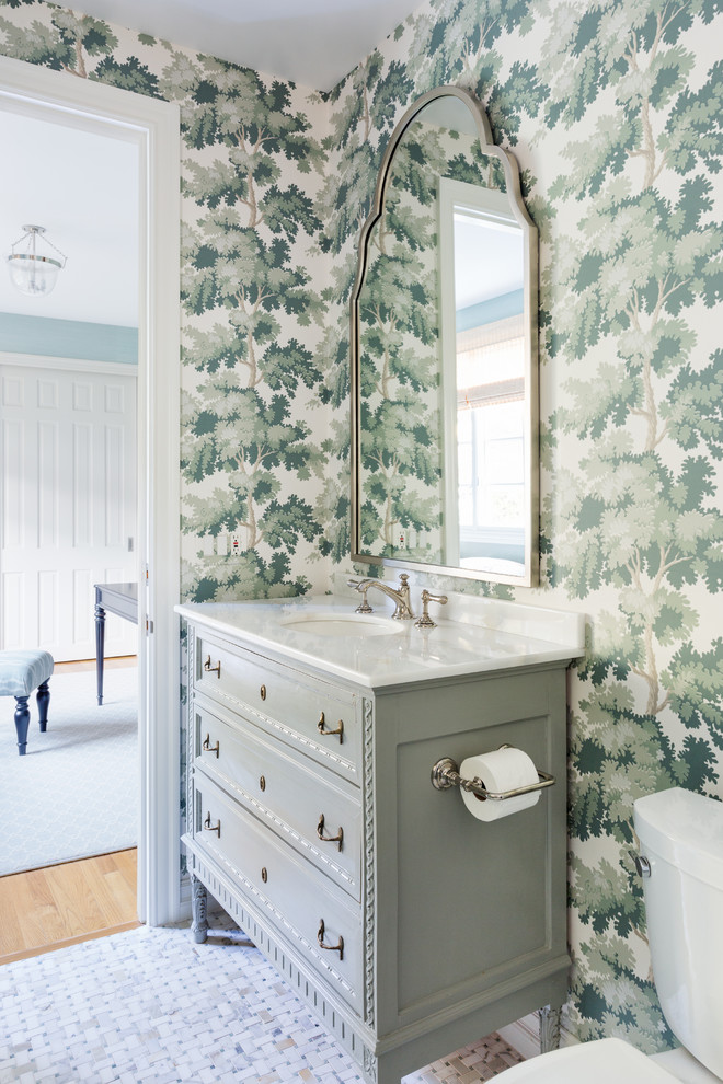 Example of a small transitional 3/4 white tile and porcelain tile mosaic tile floor and multicolored floor alcove shower design in Los Angeles with furniture-like cabinets, blue cabinets, a one-piece toilet, multicolored walls, an undermount sink, marble countertops, a hinged shower door and white countertops
