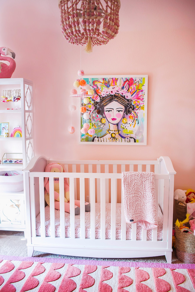 Inspiration for a transitional nursery for girls in Dallas with pink walls and carpet.