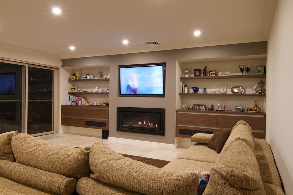 This is an example of a mid-sized contemporary living room in Sydney with travertine floors and beige floor.