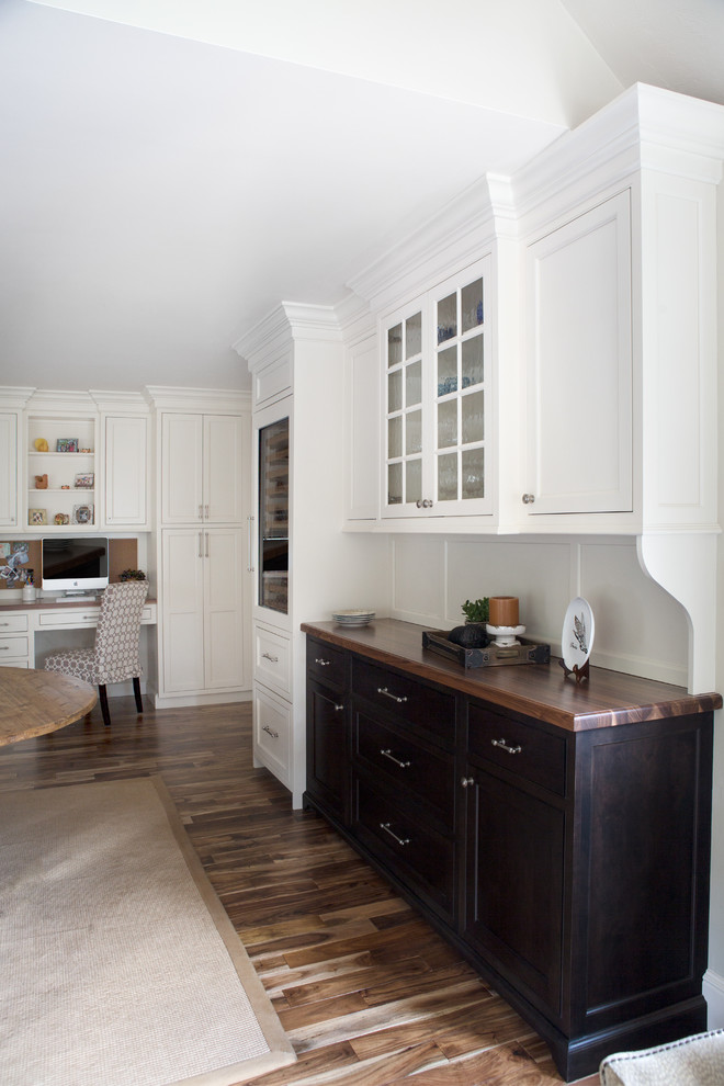 Inspiration for a large traditional u-shaped eat-in kitchen in Boston with a farmhouse sink, beaded inset cabinets, white cabinets, granite benchtops, white splashback, subway tile splashback, stainless steel appliances, medium hardwood floors and with island.