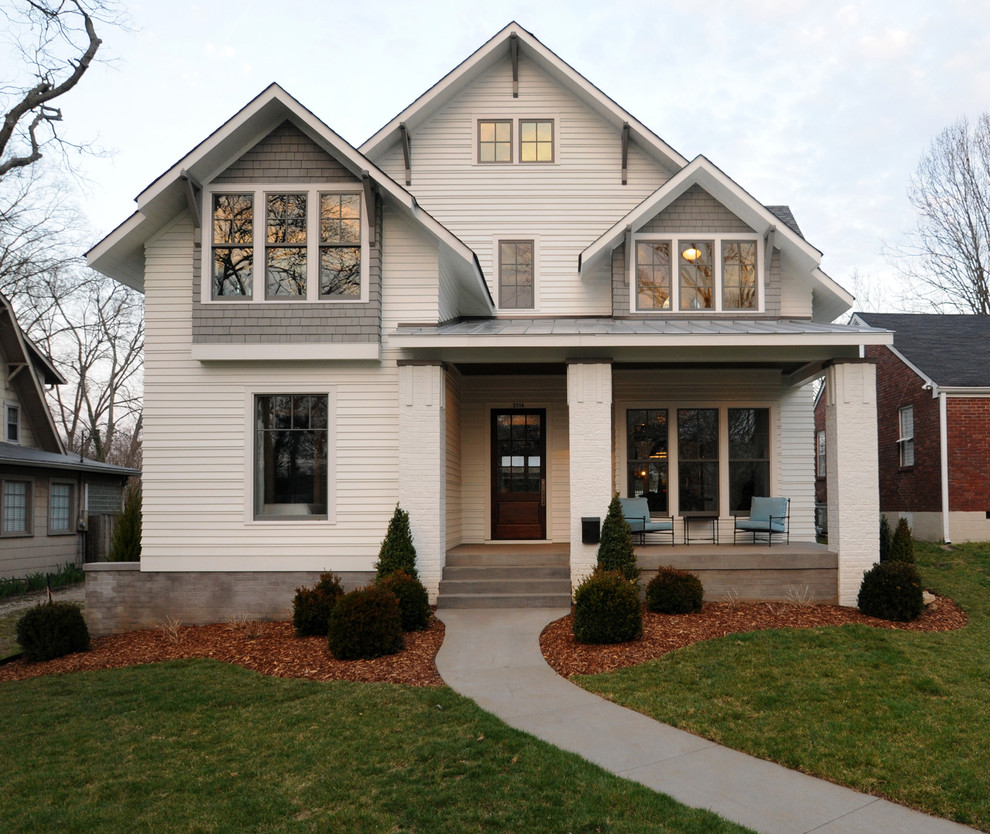 Design ideas for a transitional two-storey white exterior in Nashville.