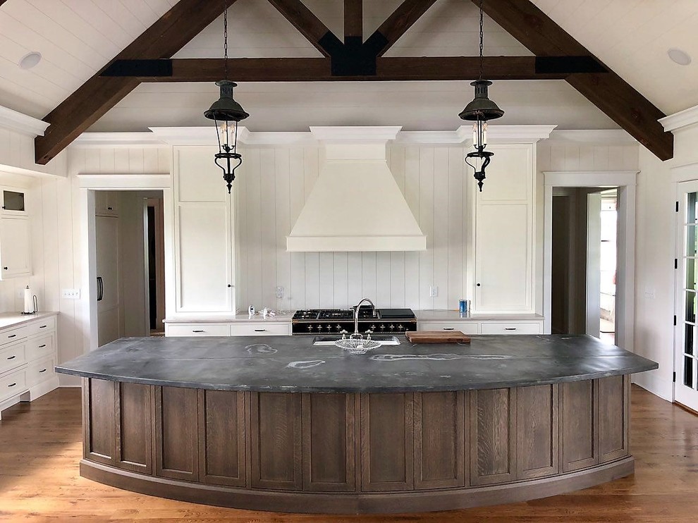 Inspiration for a large traditional eat-in kitchen in Other with a farmhouse sink, flat-panel cabinets, white cabinets, zinc benchtops, white splashback, panelled appliances, medium hardwood floors, with island, brown floor and multi-coloured benchtop.