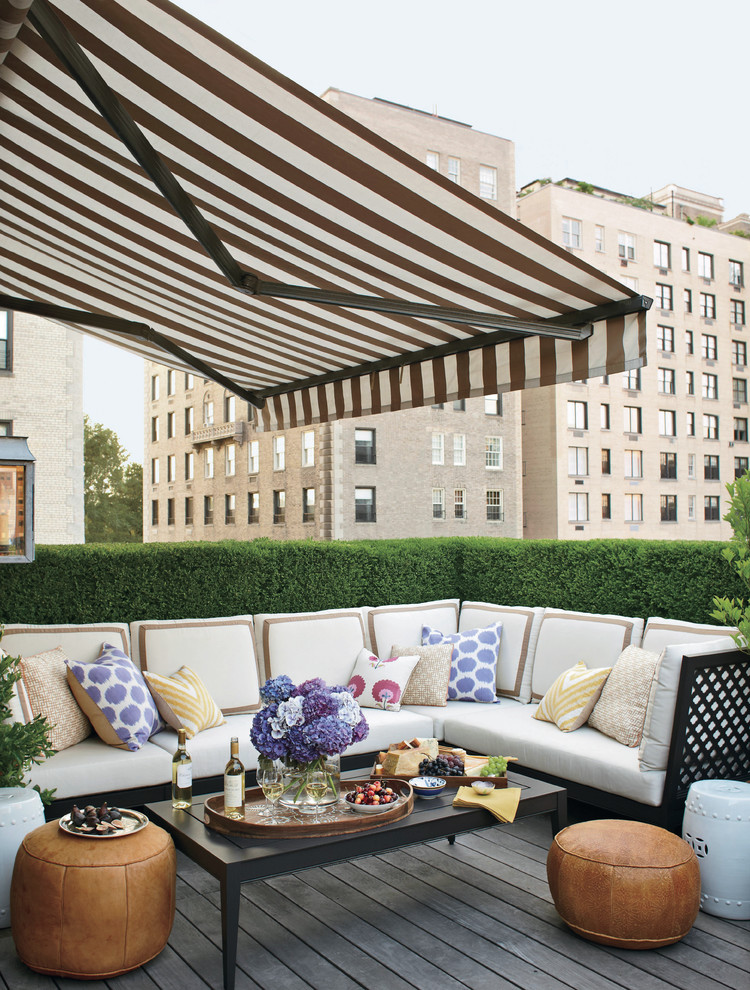 Photo of a traditional rooftop and rooftop deck in New York with an awning.