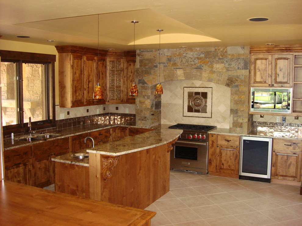 Design ideas for a large country u-shaped kitchen in Denver with a double-bowl sink, raised-panel cabinets, medium wood cabinets, laminate benchtops, metallic splashback and stainless steel appliances.