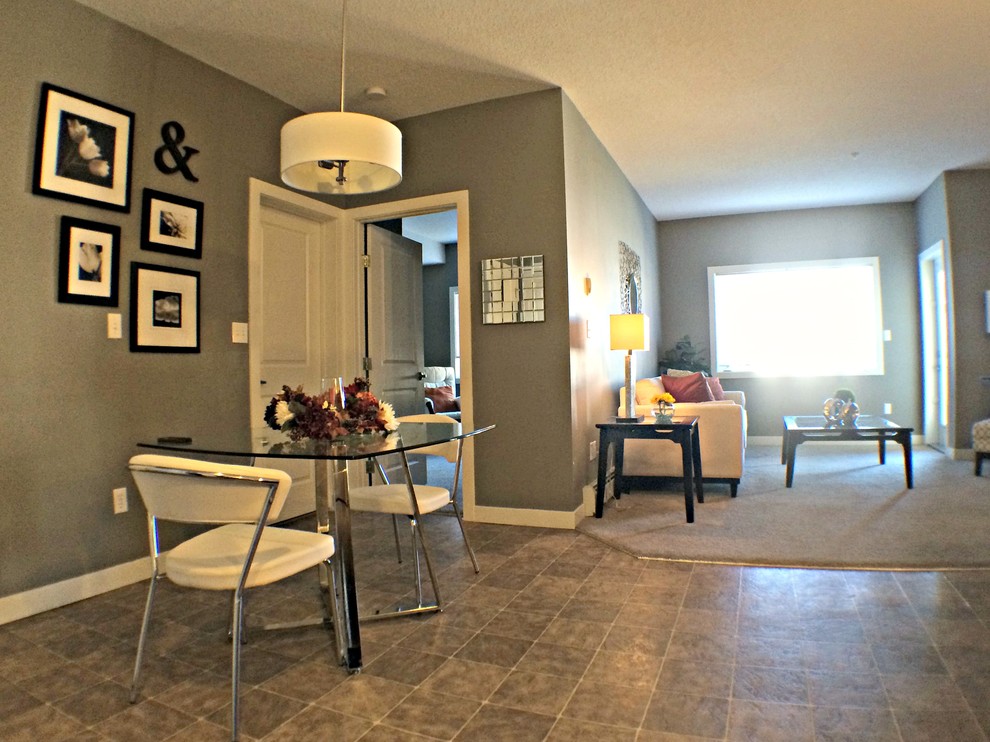 Example of a transitional home design design in Calgary
