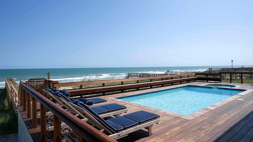 Design ideas for a beach style rectangular pool in Charleston with decking.