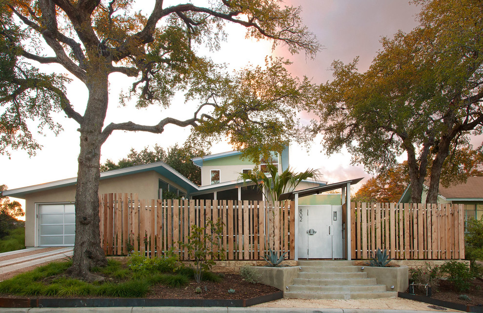Midcentury two-storey exterior in Austin with a shed roof.