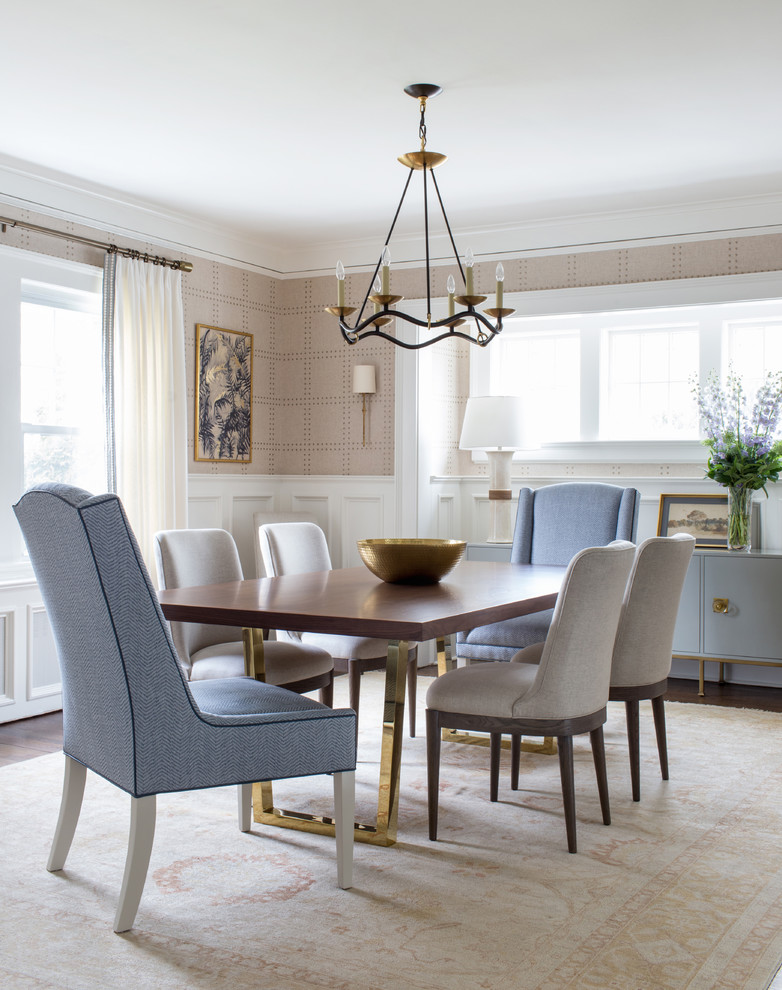 Inspiration for a transitional dining room in New York with beige walls, dark hardwood floors and brown floor.