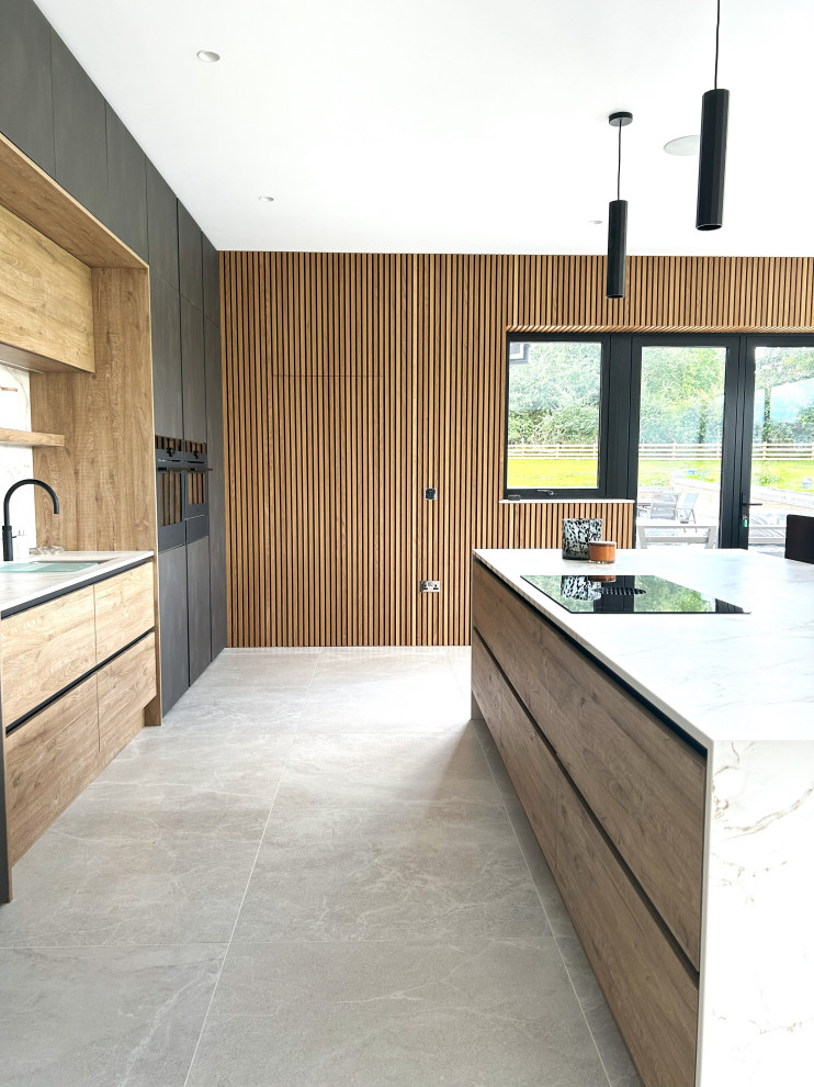 Photo of a large contemporary kitchen in Other with flat-panel cabinets, black appliances and with island.