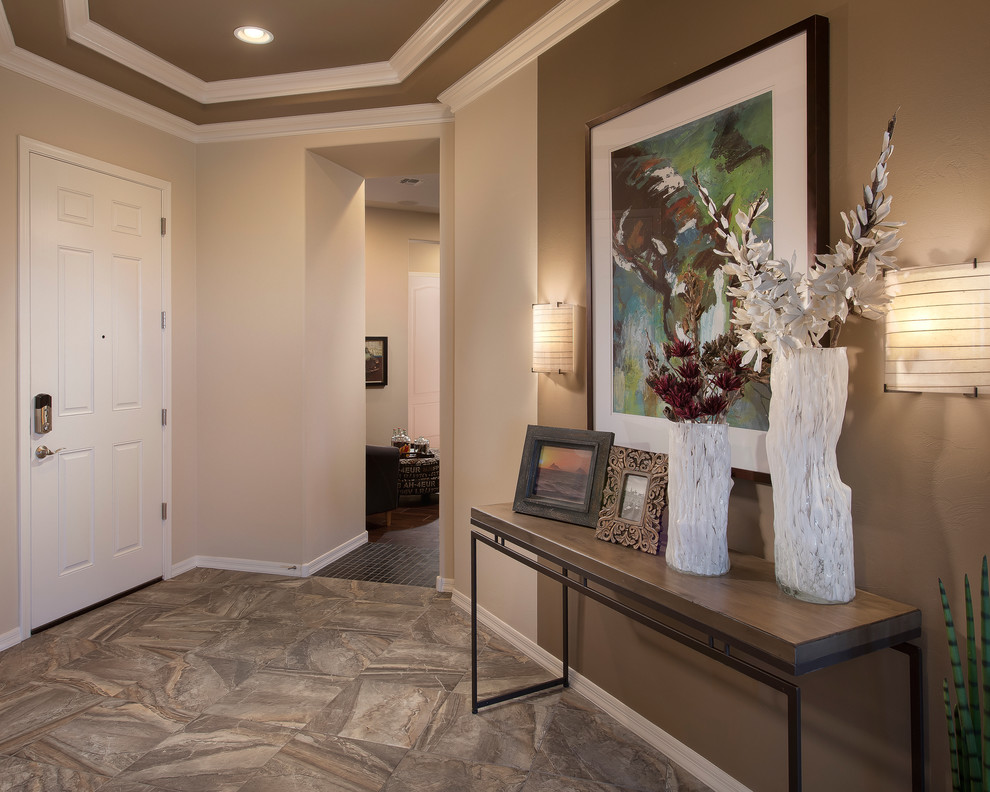 Design ideas for a contemporary entryway in Phoenix with beige walls.