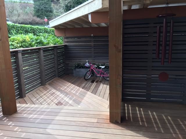 Mid-sized mountain style backyard deck photo with no cover
