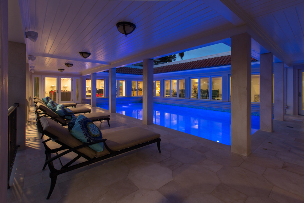 Pool - large courtyard rectangular pool idea in Miami