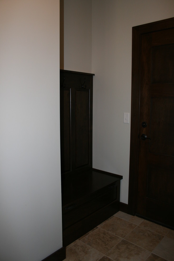 Inspiration for a rustic entryway remodel in Omaha