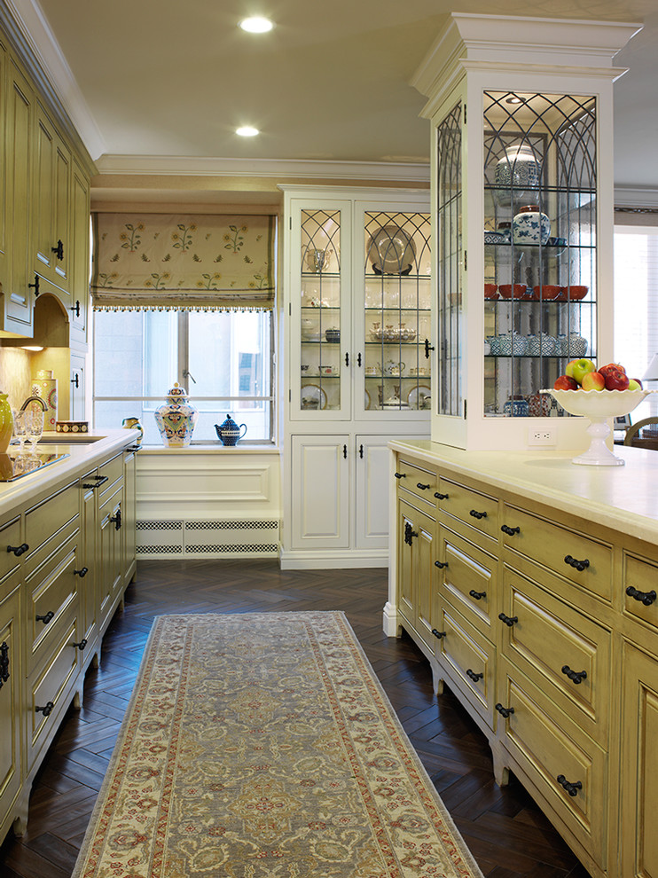 Traditional kitchen in San Francisco with glass-front cabinets.