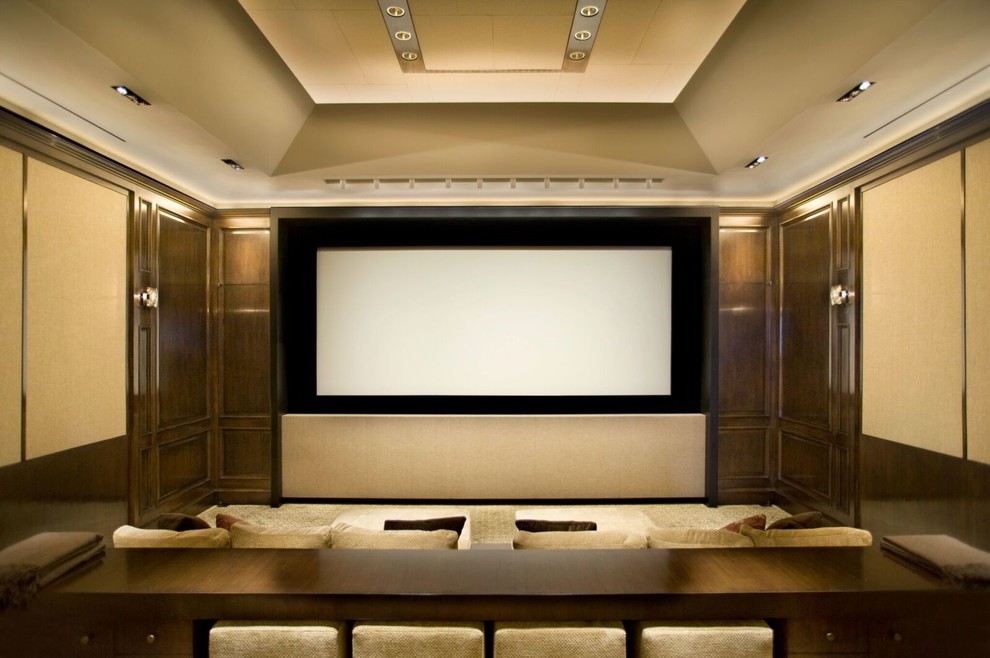 Inspiration for a large contemporary enclosed home theatre in Los Angeles with brown walls, carpet, a projector screen and brown floor.