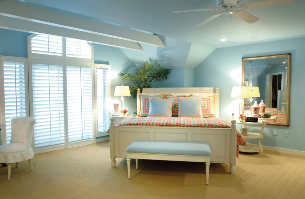 Photo of a large tropical guest bedroom in Other with blue walls, carpet and no fireplace.