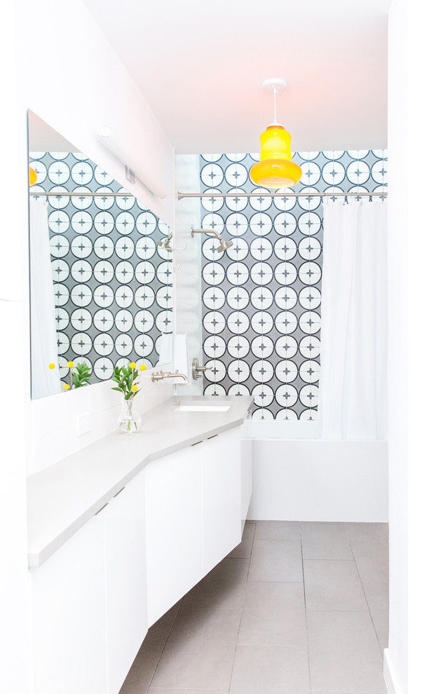 Inspiration for a small modern kids bathroom in Dallas with flat-panel cabinets, white cabinets, a drop-in tub, a shower/bathtub combo, white tile, ceramic tile, white walls, ceramic floors, an undermount sink, engineered quartz benchtops, beige floor and a shower curtain.