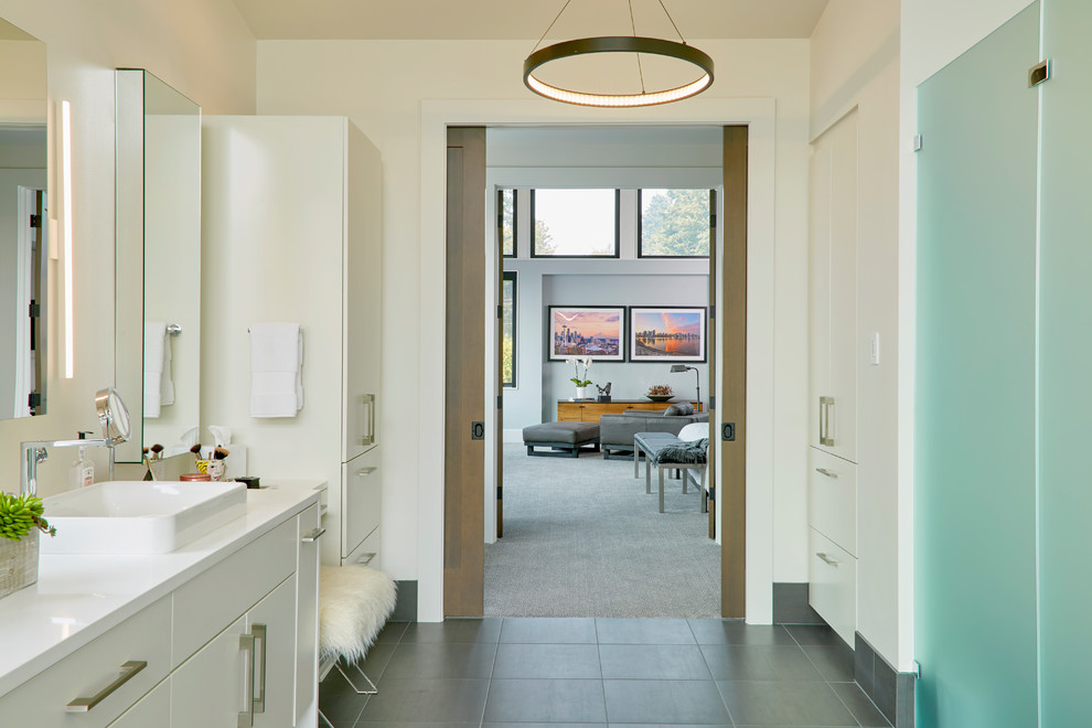 Expansive contemporary master bathroom in Seattle with flat-panel cabinets, white cabinets, white walls, a drop-in sink, engineered quartz benchtops, grey floor and white benchtops.
