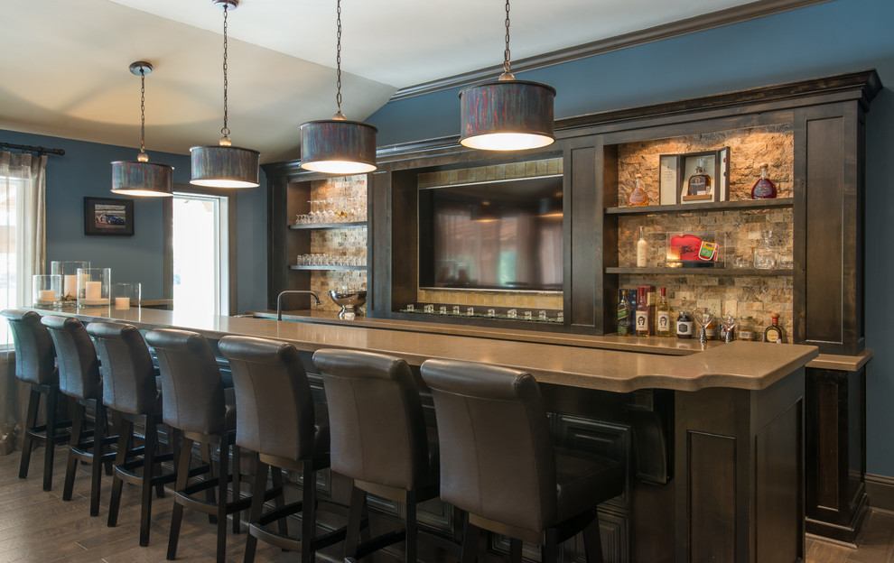 Design ideas for a transitional home bar in Houston.