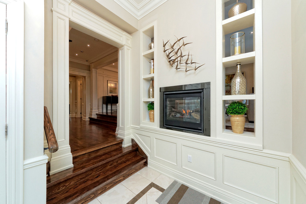 Hallway - mid-sized transitional dark wood floor and brown floor hallway idea in Toronto with beige walls