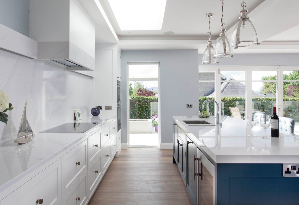 Example of a transitional kitchen design in Dublin