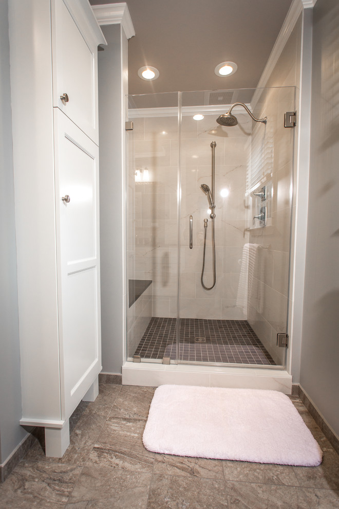 Example of a large transitional gray tile and porcelain tile porcelain tile alcove shower design in DC Metro with an undermount sink, flat-panel cabinets, white cabinets, quartz countertops, a two-piece toilet and gray walls