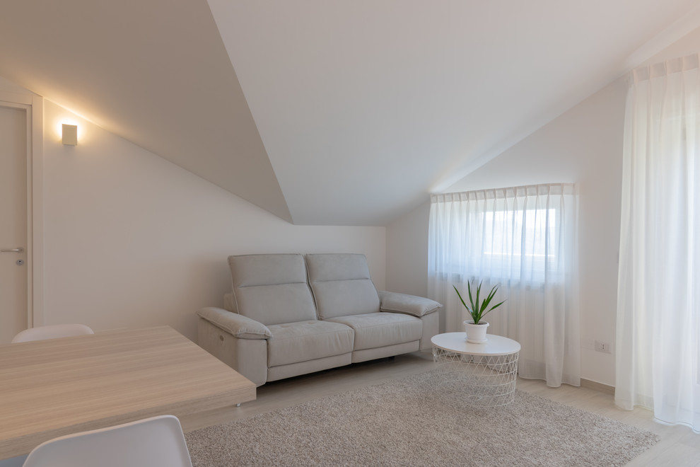 Design ideas for a small contemporary open concept living room in Other with white walls, porcelain floors and beige floor.