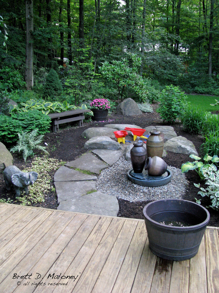 Photo of a large arts and crafts backyard partial sun garden for summer in Other with a garden path.