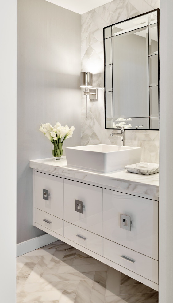 Small contemporary powder room in Phoenix with furniture-like cabinets, white cabinets, gray tile, grey walls, a vessel sink, grey floor, grey benchtops and a built-in vanity.