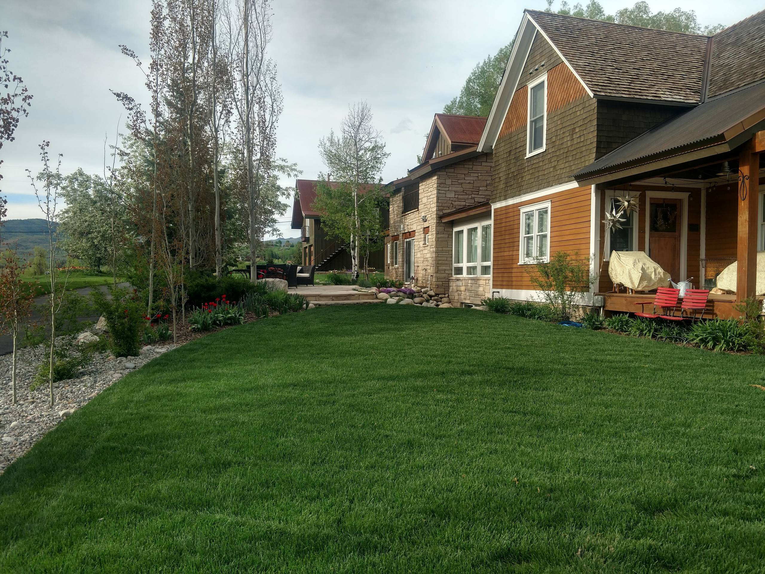 Major redo of a landscape for a quaint home in Steamboatfront yard after one yea