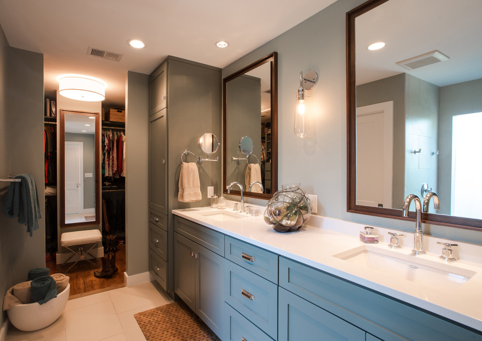 Small modern master bathroom in Austin with shaker cabinets, grey cabinets, a curbless shower, a one-piece toilet, white tile, ceramic tile, grey walls, porcelain floors, a drop-in sink, solid surface benchtops, grey floor, an open shower and white benchtops.
