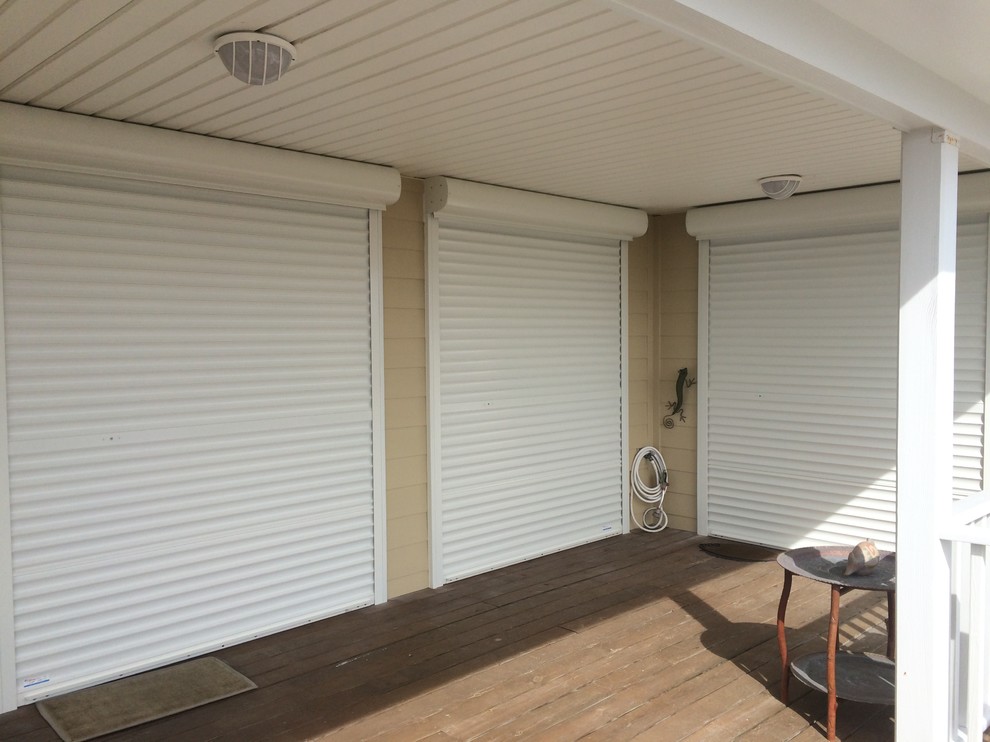 Deck - mid-sized coastal backyard deck idea with a pergola