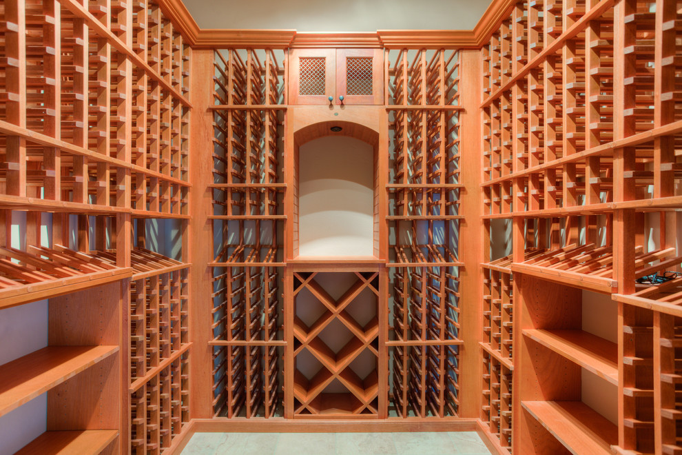 Small traditional wine cellar in Austin with porcelain floors and storage racks.