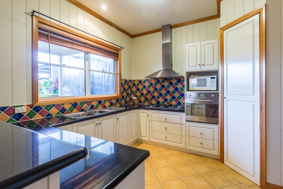 Midcentury kitchen in Other.