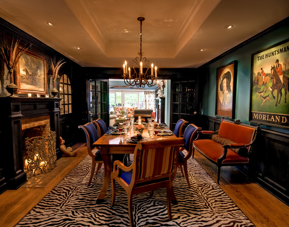 Inspiration for a mid-sized traditional separate dining room in San Francisco with dark hardwood floors, a standard fireplace, a brick fireplace surround and green walls.