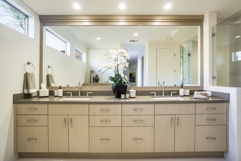 Example of a mid-sized minimalist master bathroom design in Seattle with flat-panel cabinets, light wood cabinets, soapstone countertops and white countertops