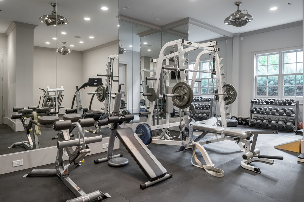 Inspiration for a transitional home weight room in Atlanta with grey walls and grey floor.