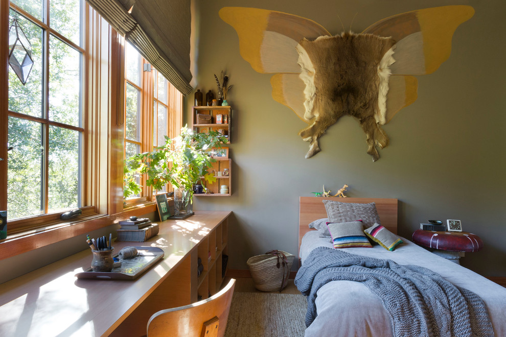 This is an example of a country bedroom in San Francisco with green walls.