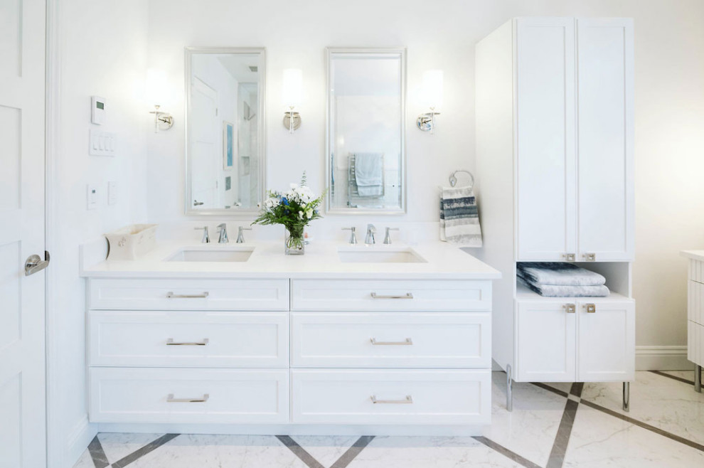 Photo of a mid-sized traditional master bathroom in Montreal with shaker cabinets, white cabinets, a freestanding tub, an open shower, a wall-mount toilet, white tile, white walls, porcelain floors, an undermount sink, engineered quartz benchtops, white floor, an open shower, white benchtops, a niche, a double vanity, a built-in vanity and wallpaper.
