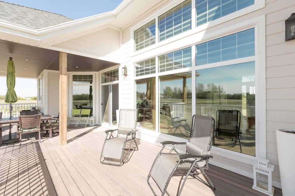 Patio - transitional backyard patio idea with decking and a roof extension