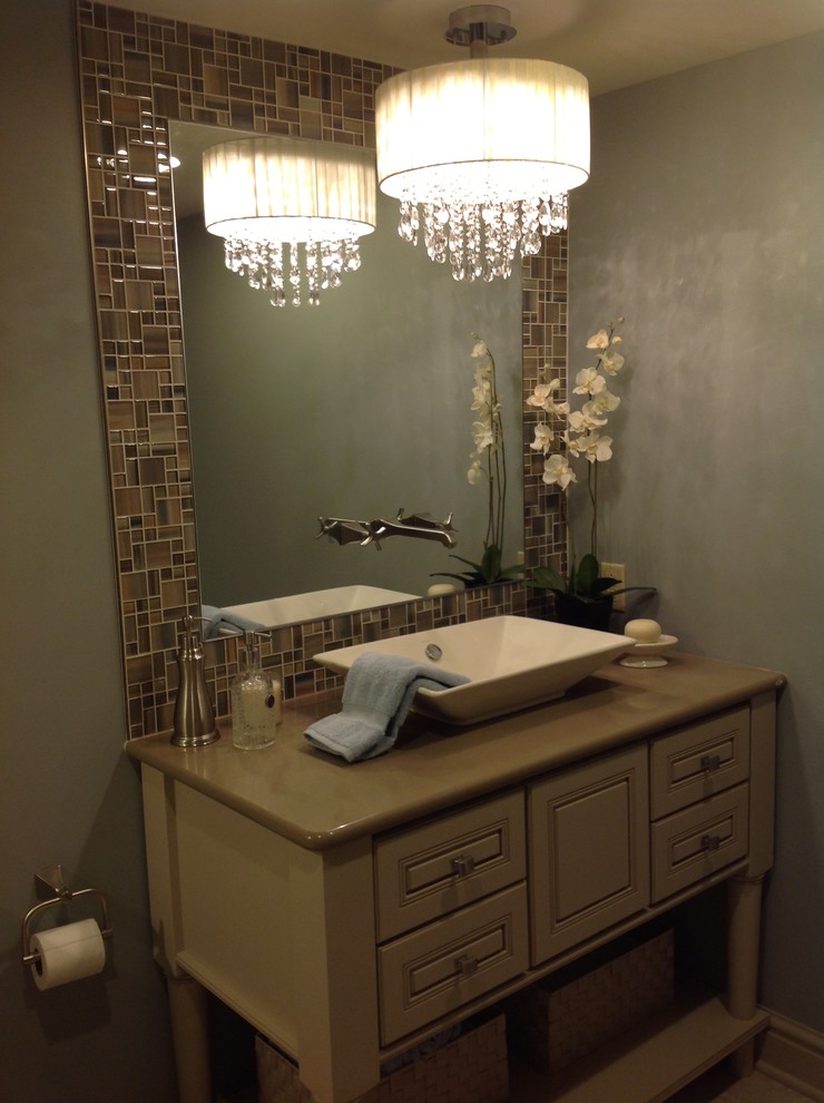 Example of a mid-sized transitional 3/4 multicolored tile alcove shower design with raised-panel cabinets, beige cabinets, solid surface countertops and blue walls