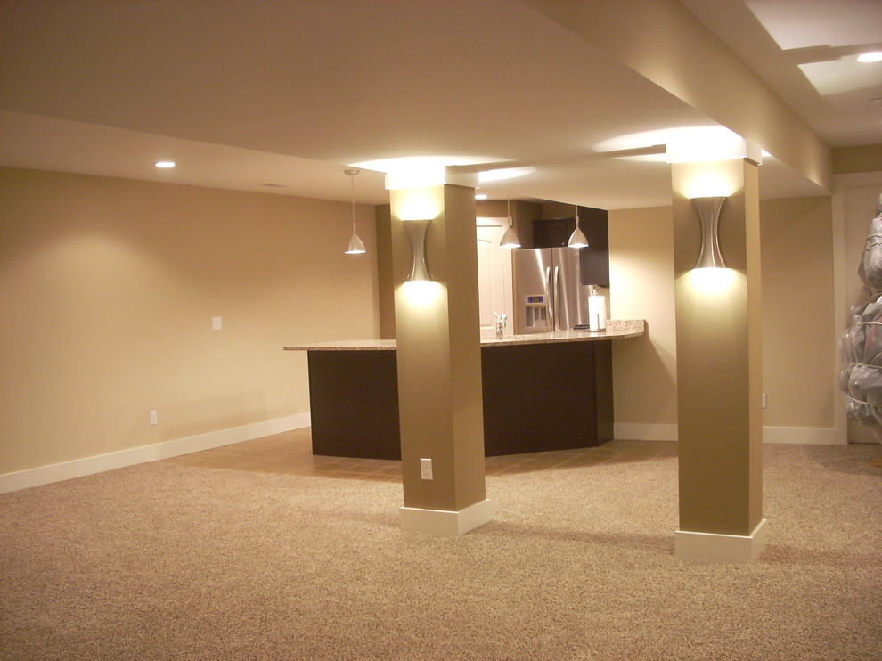 Underground carpeted basement photo with beige walls and no fireplace
